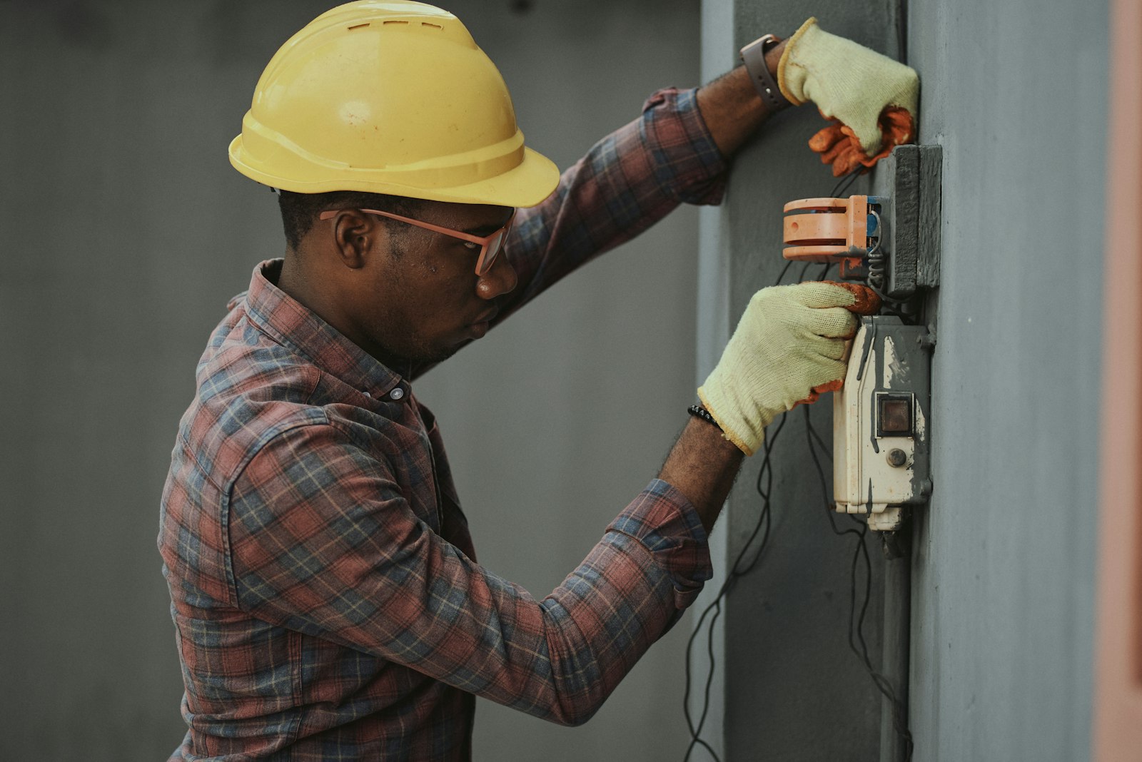 Licensed plumber working under a sink